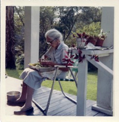 Grandma Minnie busy peeling apples to be dried and later turned to wonderful use in a stack cake.