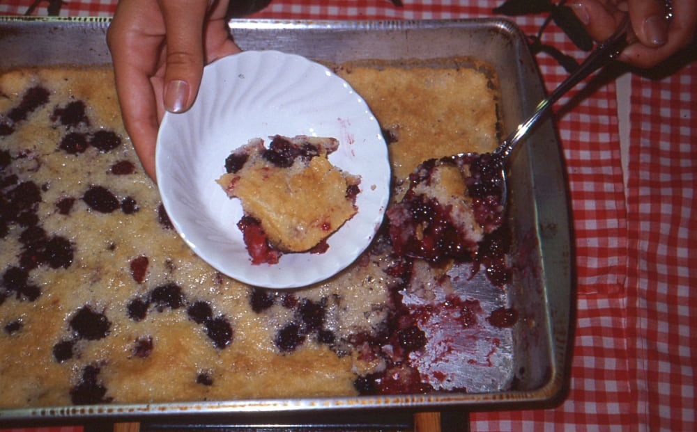 dishing up a bowl of cobbler